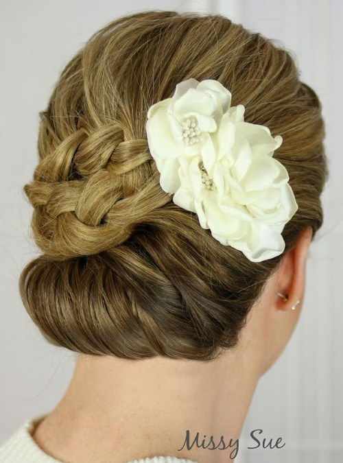 hemkomst chignon updo with a flower