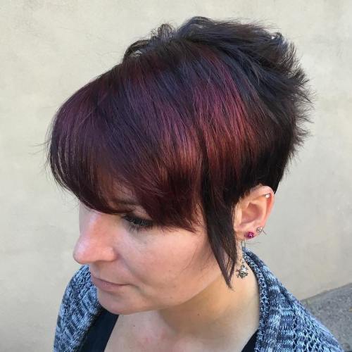 kort black hairstyle with burgundy peekaboo highlights