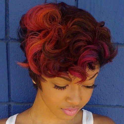 kort choppy hairstyle with pink and orange highlights