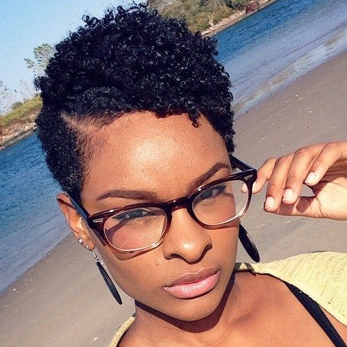 ženy's short black hairstyle with curly top