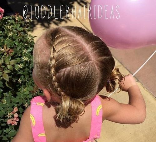flätad baby hairstyle with pigtail buns
