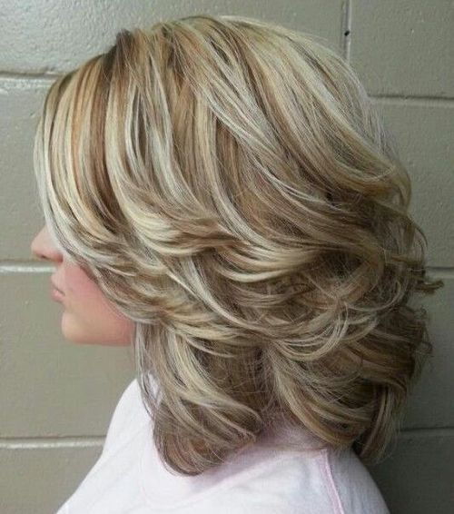 Medium Curly Hairstyles With Highlights And Back-Swept Layers