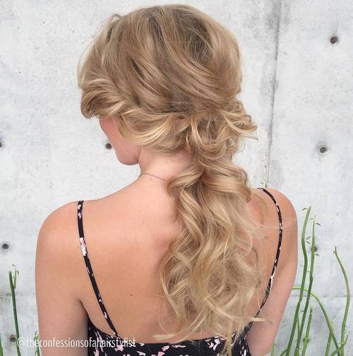 blond wavy low ponytail with side twists
