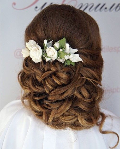 lockig wedding updo with flowers for long hair
