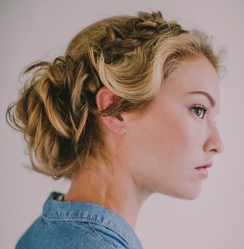 blond curly updo with a side braid