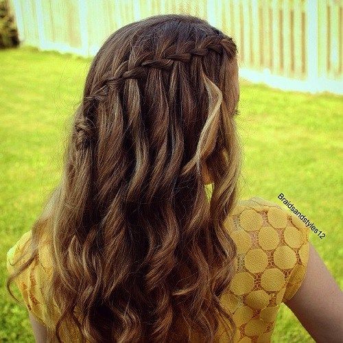lockig half up waterfall braid hairstyle