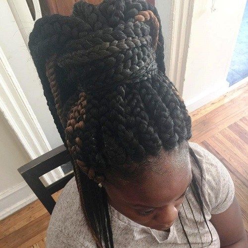 stor box braids in a chunky high ponytail