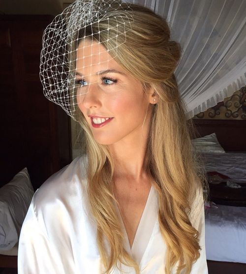 polovičná up wedding hairstyle with birdcage veil