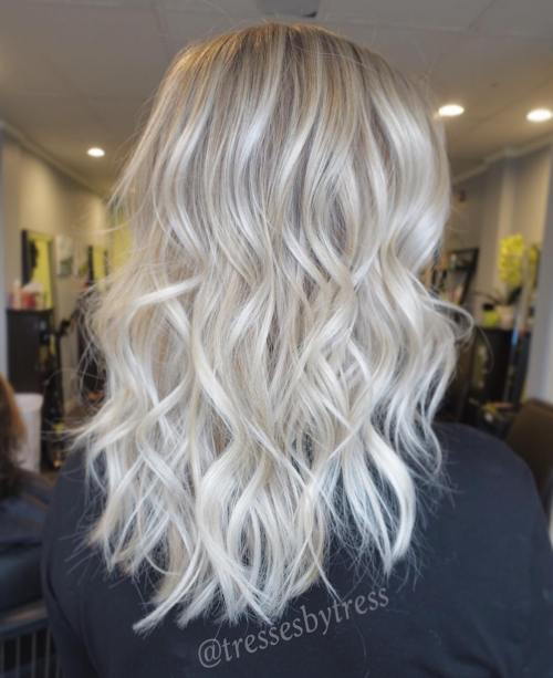 blond curly hair with darkened roots