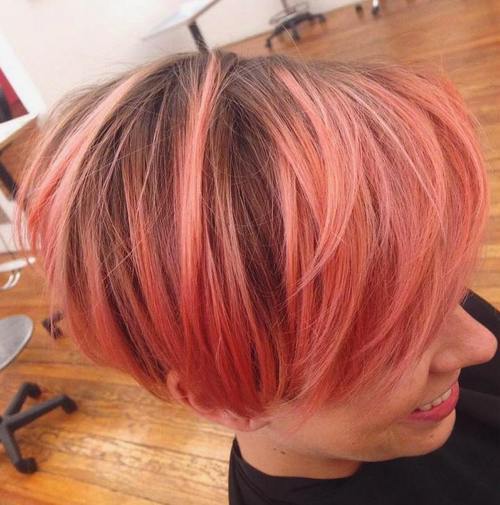 koral pink bob with brown roots