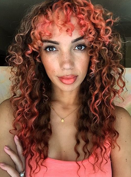 lockig brown hair with pastel pink highlights