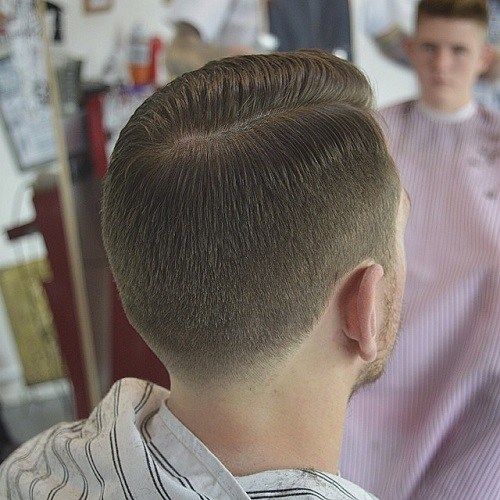 moški's tapered side part haircut