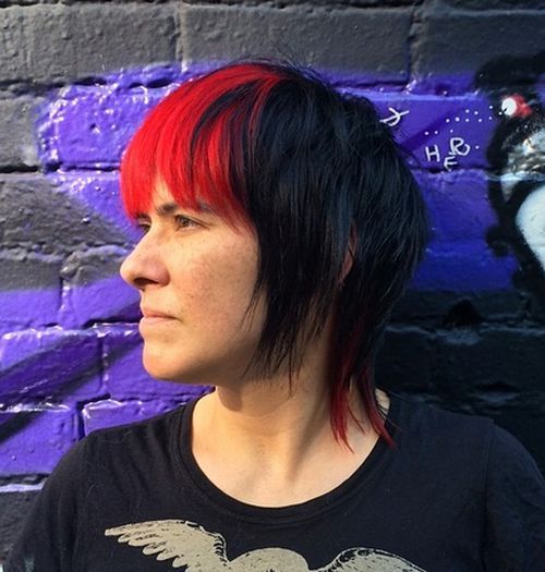 kratek black layered haircut with red bangs