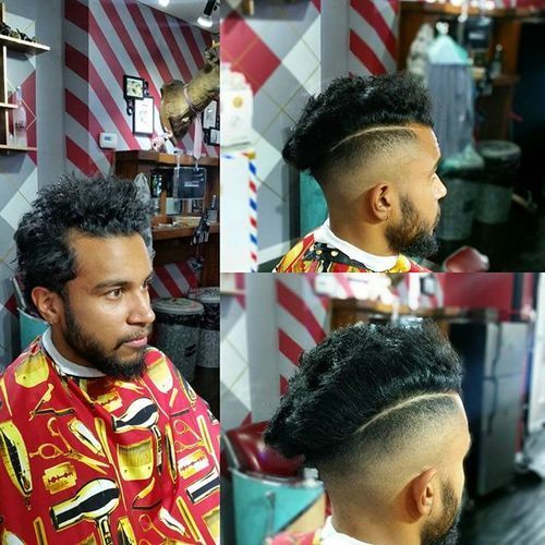 kort sides long curly top men's hairstyle