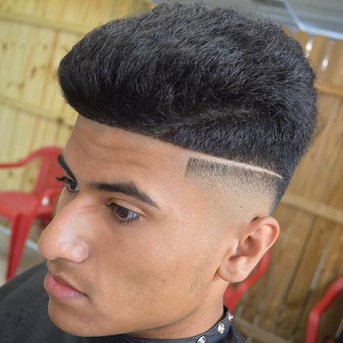 hög top haircut with fade and shaved part