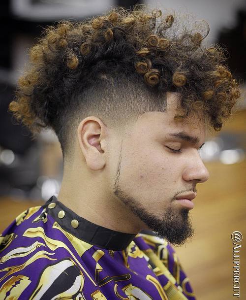 moški's curly undercut haircut
