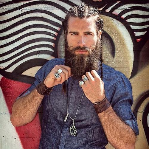 män's braids and a full beard