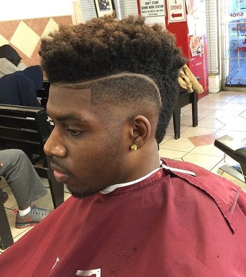 Mohawk fade haircut for black men with shaved lines