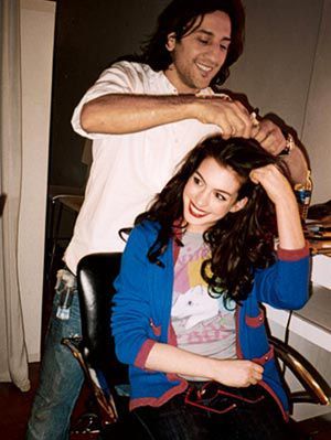 anne hathaway getting hair styled for photo shoot