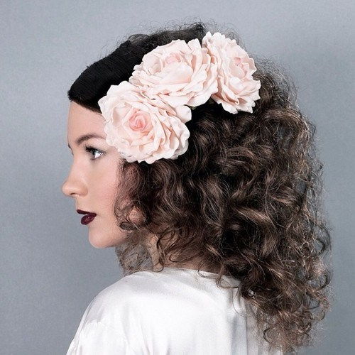 средња curly hairstyle with hair flowers