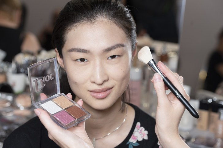 De new Dior Backstage highlighter palette being used on a model backstage at the Dior Cruise show in Chantilly, France. 