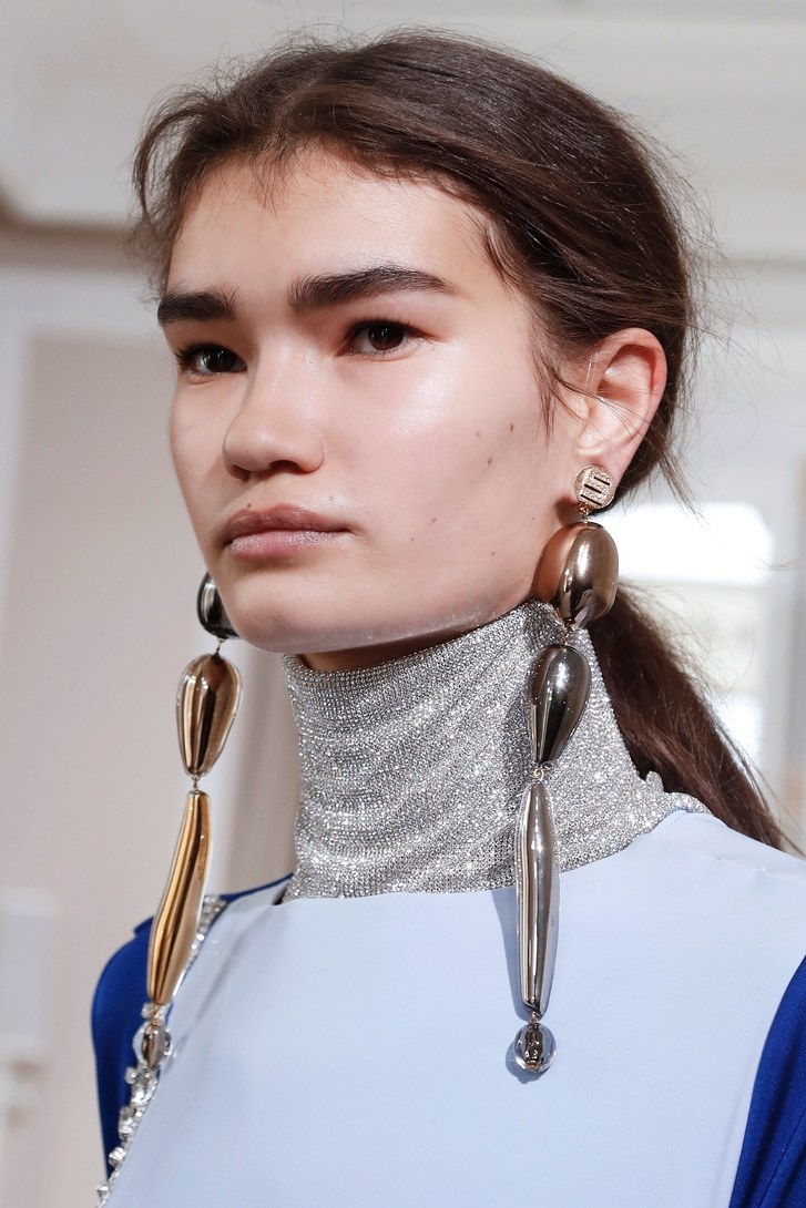 A portrait of a model walking the Schiaparelli Haute Couture Spring/Summer 2023 show. 