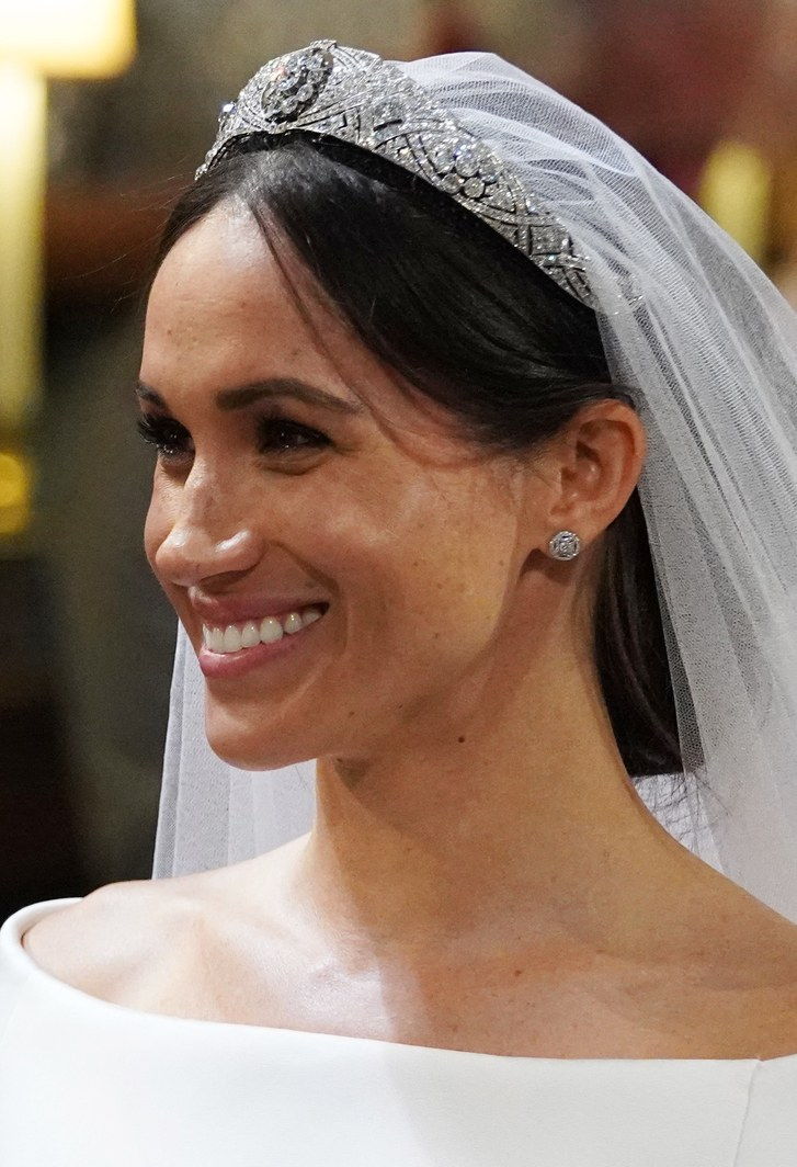 Meghan Markle smiles during her wedding to Prince Harry in St George's Chapel at Windsor Castle on May 19, 2023 in Windsor, England. 