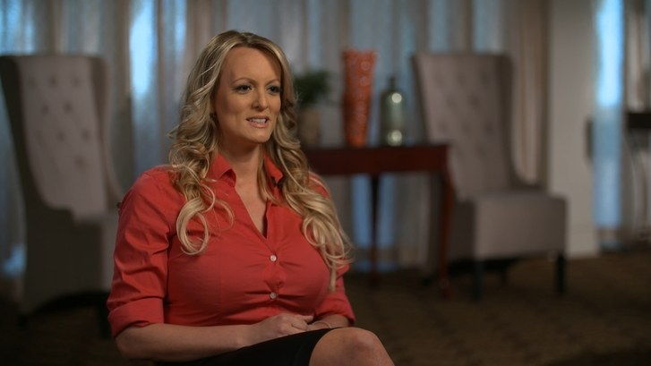 Adult film actress Stormy Daniels sits down in a red shirt while being interviewed by Anderson Cooper for 