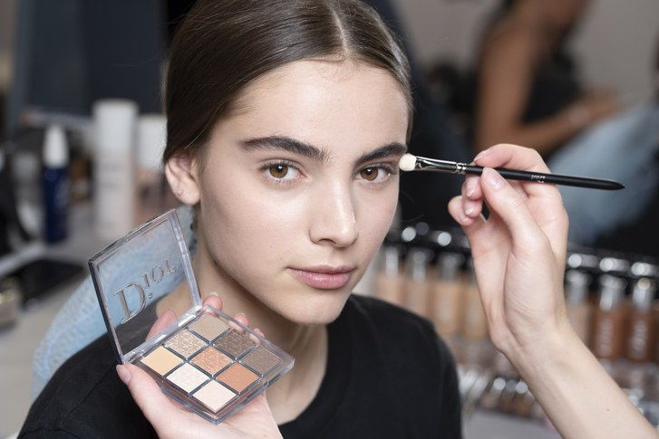 De new Dior Backstage eye shadow palette being used on a model backstage at the Dior Cruise show in Chantilly, France. 