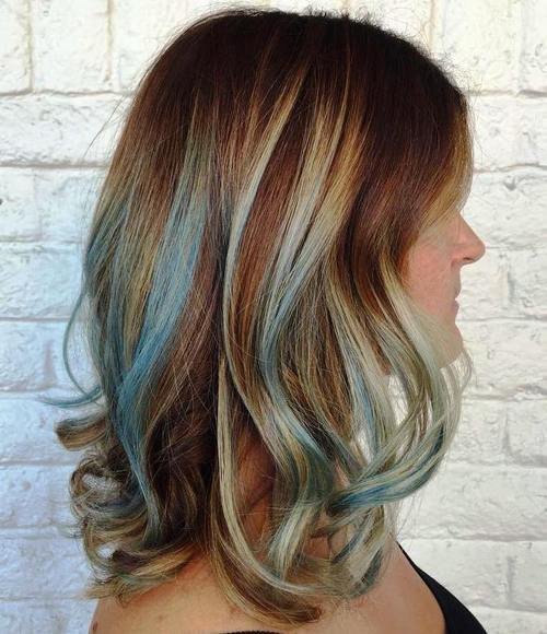medium brown hairstyle with pastel blue highlights