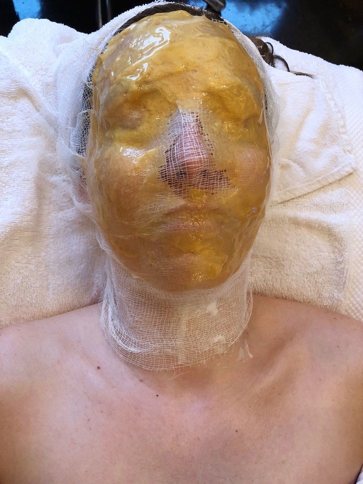 Locka editor Sarah Kinonen wears collagen mask during Joanna Vargas facial