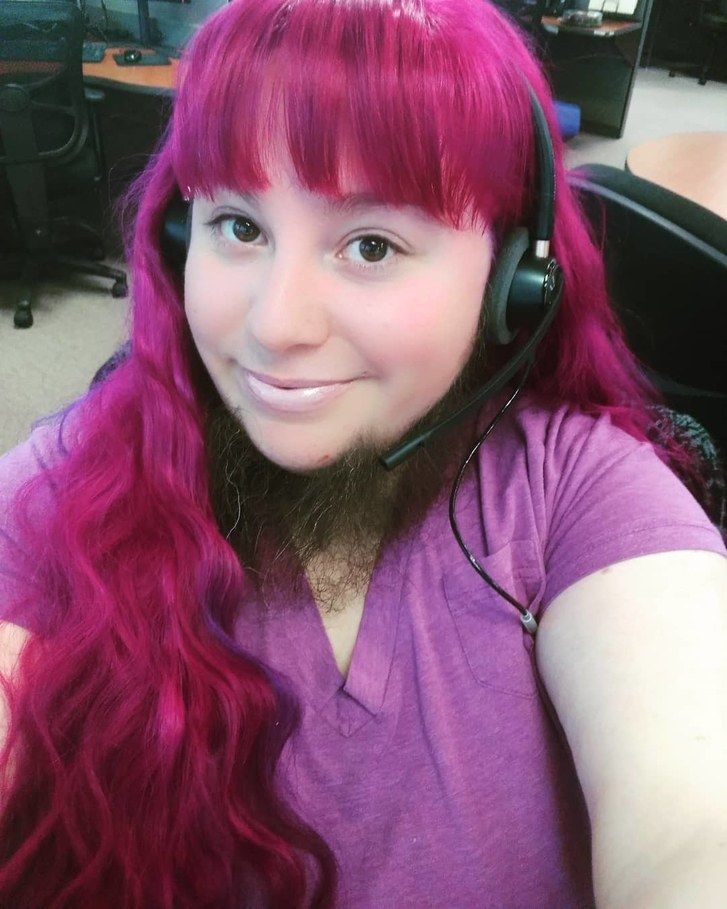 Annalisa Hackleman in purple tee with hair down